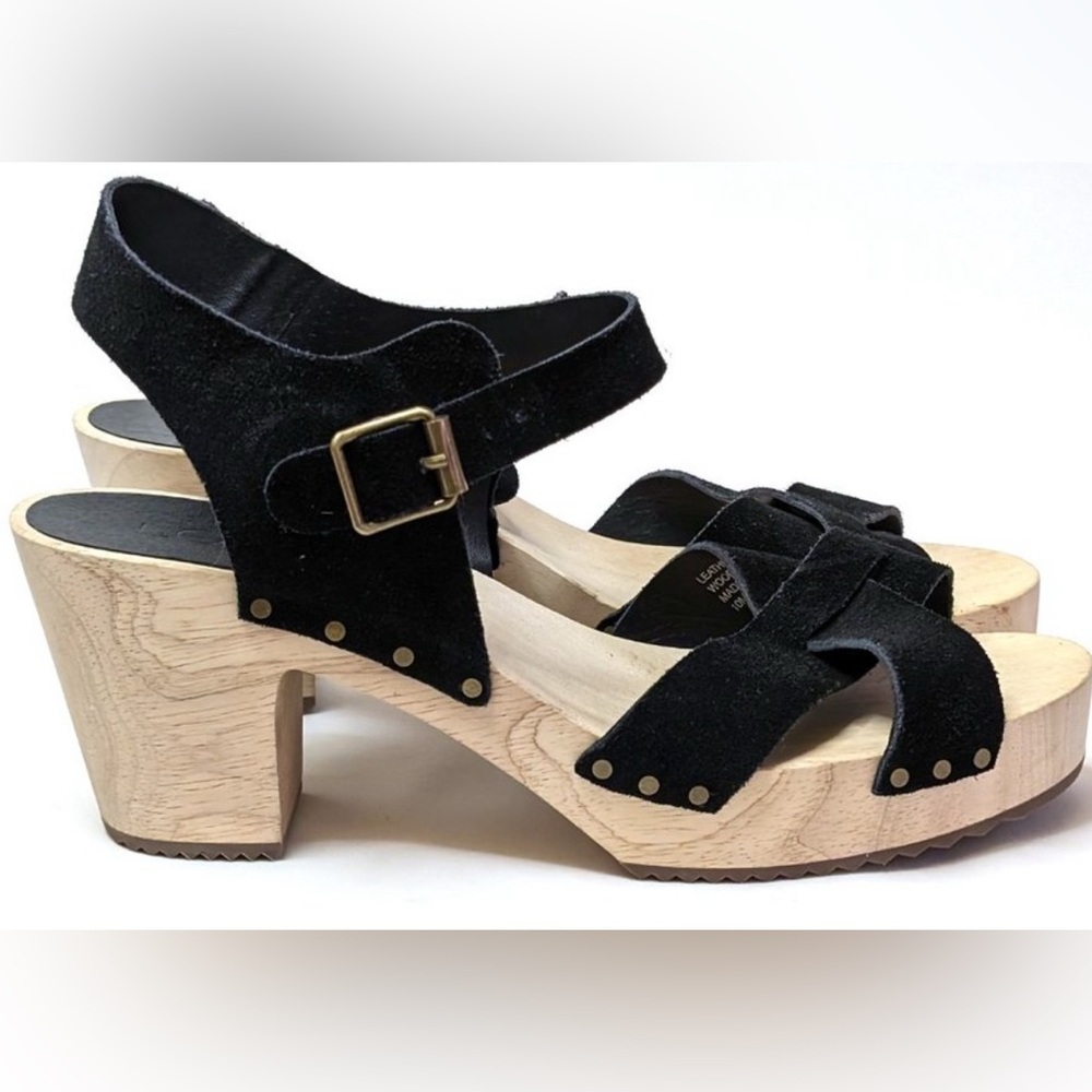 Women’s black suede wooden chunky sandals. Loft size 8.5
NWOT